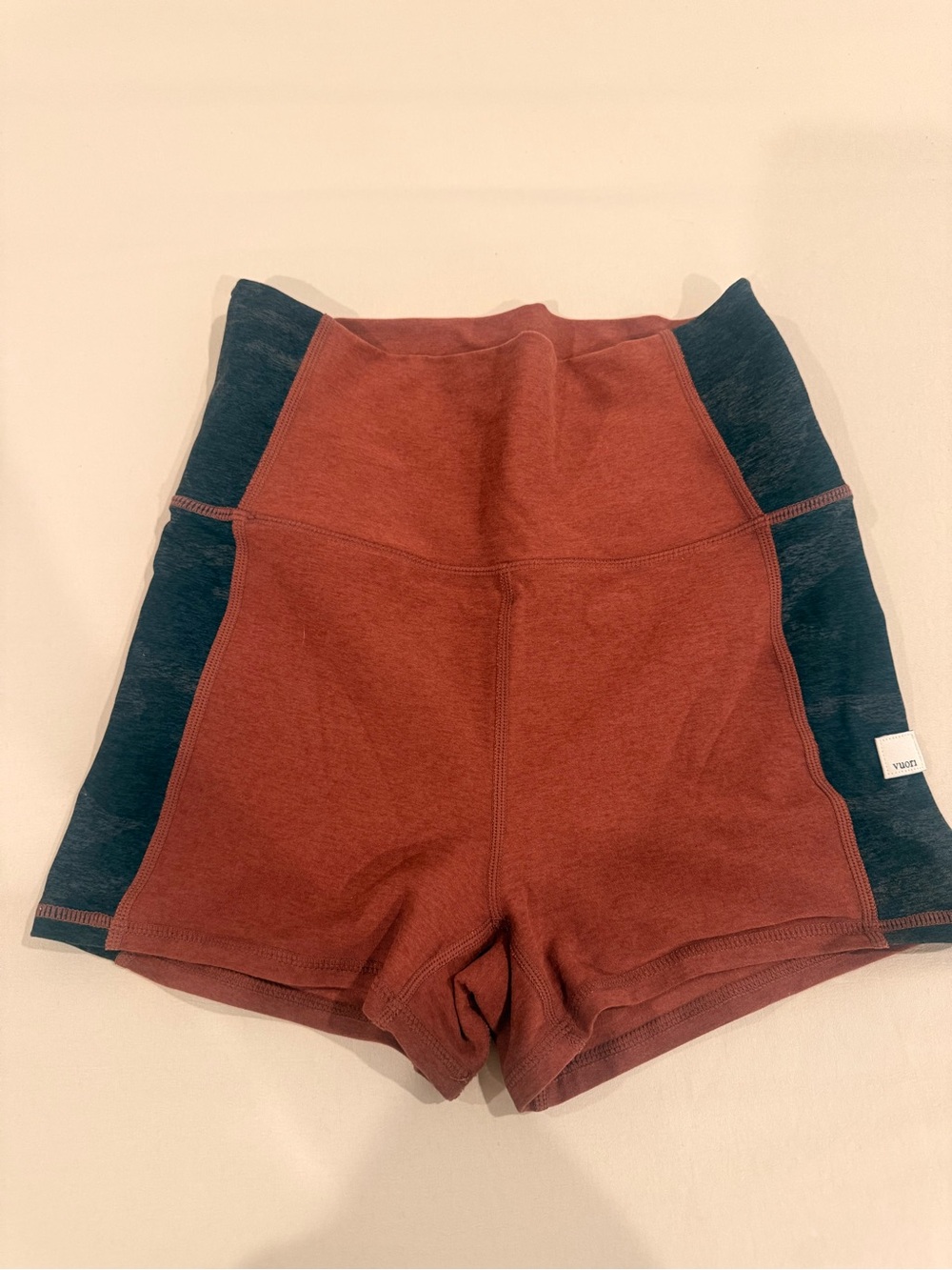 Vuori High-Rise Rust and Black Bike Shorts — Women's Activewear